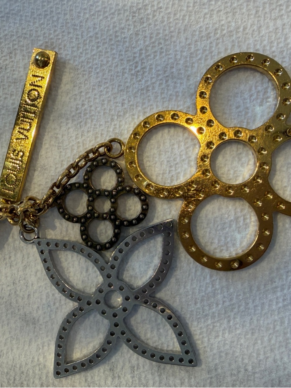 Louis Vuitton Gold Tone Logo Bar Key Charm with Dark Metal Accents